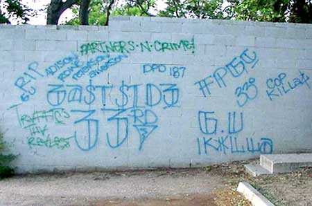 I couldn't find one of the images from the text, so here is some random gang graffiti - taken from people.howstuffworks.com 